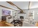 Living room with hardwood floors and exposed beams at 2228 Valencia Ter, Charlotte, NC 28226