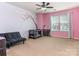 Pink bedroom with a crib and plenty of natural light at 2262 Galloway Sw Ln # 330, Concord, NC 28025