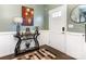 Bright entryway with a console table, mirror, and wood flooring at 2262 Galloway Sw Ln, Concord, NC 28025