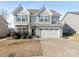 Two-story house with gray siding, white trim, and a two-car garage at 2262 Galloway Sw Ln, Concord, NC 28025