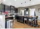 Modern kitchen with dark wood cabinets, granite counters and stainless steel appliances at 2262 Galloway Sw Ln, Concord, NC 28025