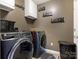 Laundry room with washer, dryer, and overhead cabinets at 2262 Galloway Sw Ln, Concord, NC 28025