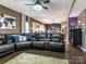 Open concept living room and kitchen with hardwood floors and a leather sectional at 2262 Galloway Sw Ln, Concord, NC 28025