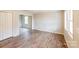 Dining area with wood-look flooring and view into kitchen at 2331 Celia Ave, Charlotte, NC 28216