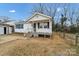 Charming white house with front porch and yard at 2331 Celia Ave, Charlotte, NC 28216