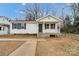 Charming one-story home with a front porch and landscaping at 2331 Celia Ave, Charlotte, NC 28216