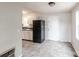 Basic kitchen with white cabinets and tile floor at 2331 Celia Ave, Charlotte, NC 28216