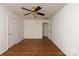 Spacious bedroom with hardwood floors and ceiling fan at 2400 Potter Downs Dr, Waxhaw, NC 28173