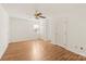 Simple bedroom with hardwood floors and ceiling fan at 2400 Potter Downs Dr, Waxhaw, NC 28173