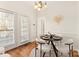 Charming dining area with a round table and four white chairs near French doors at 2400 Potter Downs Dr, Waxhaw, NC 28173