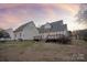 Rear view of house, showcasing a large deck at 2400 Potter Downs Dr, Waxhaw, NC 28173