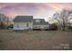 Back of house with large deck and propane tank at 2400 Potter Downs Dr, Waxhaw, NC 28173