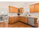 Bright kitchen with wood cabinets, hardwood floors, and stainless steel appliances at 2400 Potter Downs Dr, Waxhaw, NC 28173