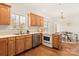 Kitchen boasts wood cabinets, stainless steel appliances, and hardwood floors at 2400 Potter Downs Dr, Waxhaw, NC 28173