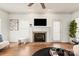 Living room with fireplace, hardwood floors, and neutral decor at 2400 Potter Downs Dr, Waxhaw, NC 28173