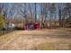 Red storage shed in backyard, providing extra storage space at 2400 Potter Downs Dr, Waxhaw, NC 28173