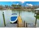 Private boat dock with covered slip and steps to the lake at 260 Wood Duck Loop, Mooresville, NC 28117