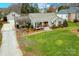 House exterior showcasing a well-maintained lawn and driveway at 260 Wood Duck Loop, Mooresville, NC 28117