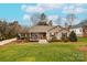 Well-maintained ranch home with front porch and landscaped yard at 260 Wood Duck Loop, Mooresville, NC 28117