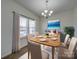 Dining room with hardwood floors, window, and staged dining set at 2841 Kinloch Ct, Clover, SC 29710