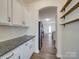 White kitchen with granite countertops and built-in shelving at 2841 Kinloch Ct, Clover, SC 29710