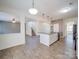 Open concept kitchen and dining area with island and hardwood floors at 2841 Kinloch Ct, Clover, SC 29710