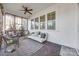 Relaxing screened porch with wicker furniture and decorative rug at 324 Mill Ridge Rd, Rock Hill, SC 29730