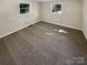 Well-lit bedroom featuring neutral carpeting at 333 S High St, Waxhaw, NC 28173