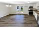 Dining area with wood-look floors and access to back patio at 333 S High St, Waxhaw, NC 28173