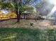 Front yard view of brick ranch house with landscaping at 333 S High St, Waxhaw, NC 28173