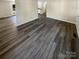 Open living space with wood-look floors and view to kitchen at 333 S High St, Waxhaw, NC 28173