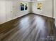 Bright living room featuring new vinyl plank flooring and neutral walls at 333 S High St, Waxhaw, NC 28173