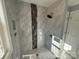 Bathroom with a large walk-in shower and marble-look tile at 3463 Lake Shore S Dr, Denver, NC 28037