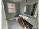 Bathroom with dark vanity and marble-look tile floor at 3462 Lake Shore S Dr, Denver, NC 28037