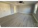 Bright bedroom with hardwood floors and double doors to closet at 3463 Lake Shore S Dr, Denver, NC 28037