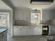 Renovated kitchen featuring white cabinets and granite countertops at 3463 Lake Shore S Dr, Denver, NC 28037