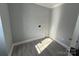 Simple laundry room with vinyl flooring and hookups at 3462 Lake Shore S Dr, Denver, NC 28037