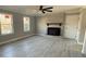 Spacious living room with fireplace and hardwood-style floors at 3463 Lake Shore S Dr, Denver, NC 28037