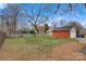 Large backyard with detached garage and mature trees at 357 7Th Nw St, Hickory, NC 28601