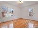 Bright bedroom with hardwood floors and large windows at 357 7Th Nw St, Hickory, NC 28601