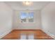 Bright bedroom with hardwood floors and large windows at 357 7Th Nw St, Hickory, NC 28601