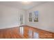 Bright bedroom with hardwood floors and window views at 357 7Th Nw St, Hickory, NC 28601