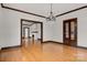 Elegant dining room with hardwood floors, chandelier, and built-in shelving at 357 7Th Nw St, Hickory, NC 28601