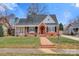 Brick home with a charming front porch and well-manicured lawn at 357 7Th Nw St, Hickory, NC 28601