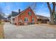 Rear view of brick house, showcasing the deck and yard at 357 7Th Nw St, Hickory, NC 28601