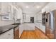 Spacious kitchen with granite countertops and white cabinetry at 357 7Th Nw St, Hickory, NC 28601