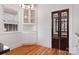 Corner kitchen with white cabinets, granite counters and built-in shelving at 357 7Th Nw St, Hickory, NC 28601