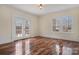 Spacious living area with hardwood floors and French doors at 357 7Th Nw St, Hickory, NC 28601