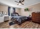 Well-lit bedroom with wood floors, a dresser and full bed at 3717 Elliott Cemetary Rd, Shelby, NC 28150