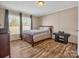 Guest bedroom with wood floors and a full-size bed at 3717 Elliott Cemetary Rd, Shelby, NC 28150